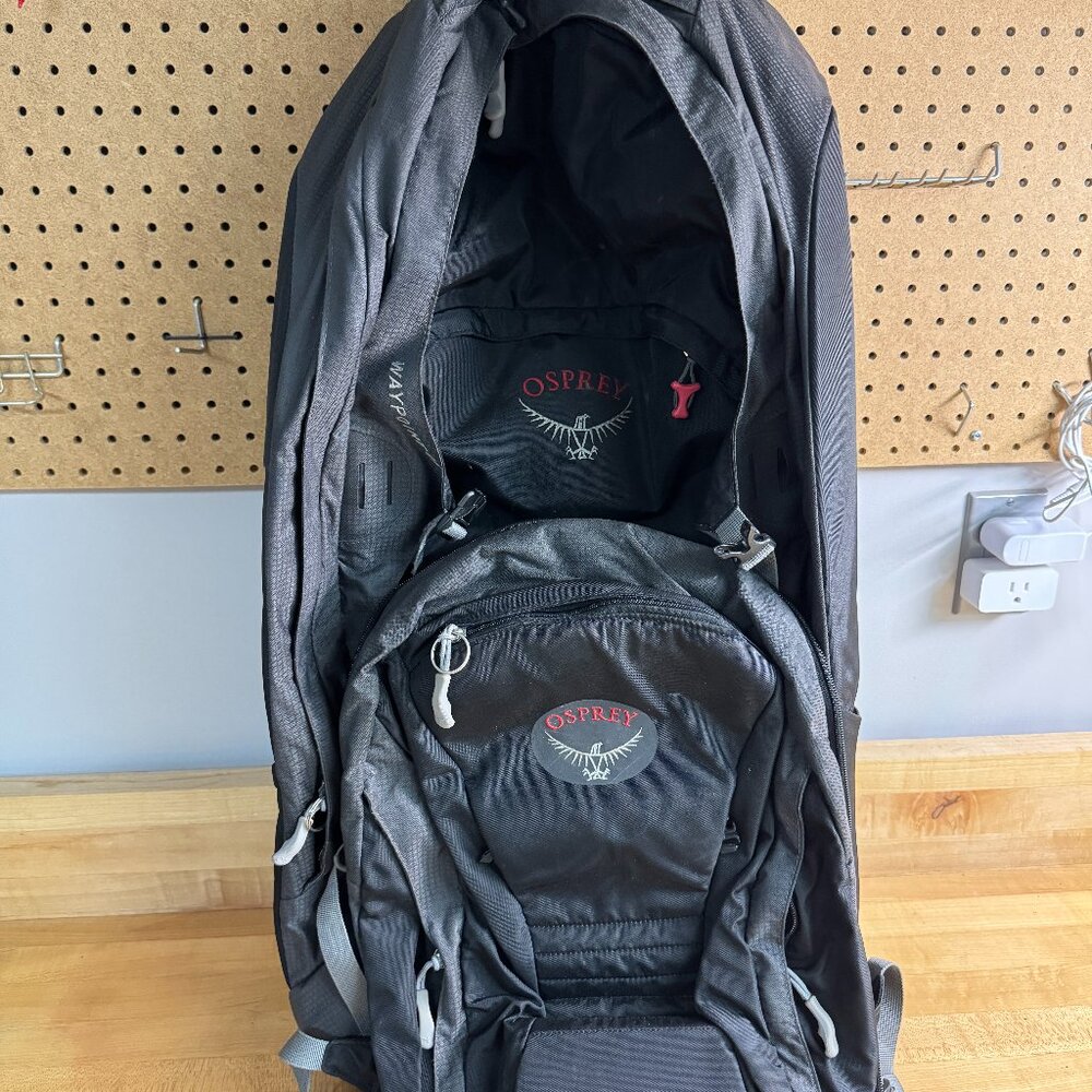 Osprey Waypoint 70l Backpack and daypack. daypack is attachable. rain cover.